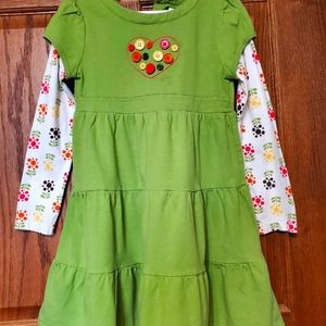 Girls dress with multicolored buttons and flowers.